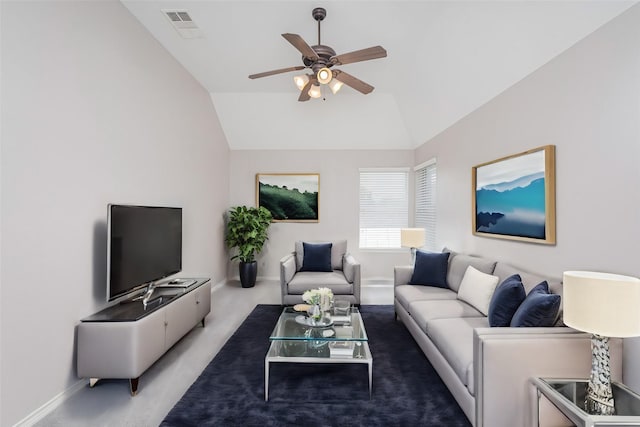 carpeted living room featuring vaulted ceiling and ceiling fan