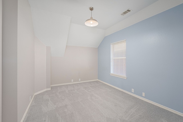 bonus room featuring light carpet and lofted ceiling