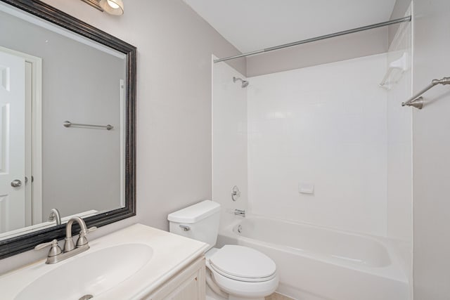 full bathroom featuring vanity, tiled shower / bath combo, and toilet