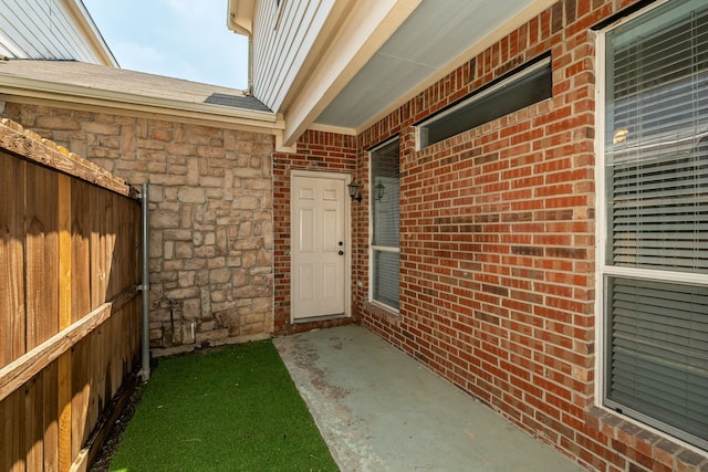 entrance to property with a patio