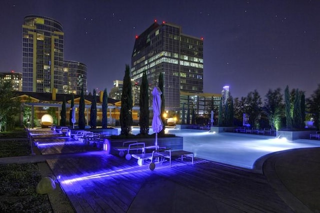 view of home's community featuring a patio area and a pool