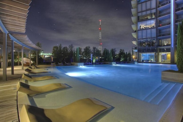 view of pool at night