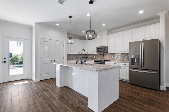 kitchen featuring sink, white cabinetry, appliances with stainless steel finishes, an island with sink, and light stone countertops