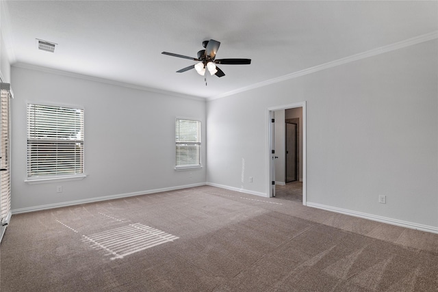 carpeted empty room with ornamental molding and ceiling fan