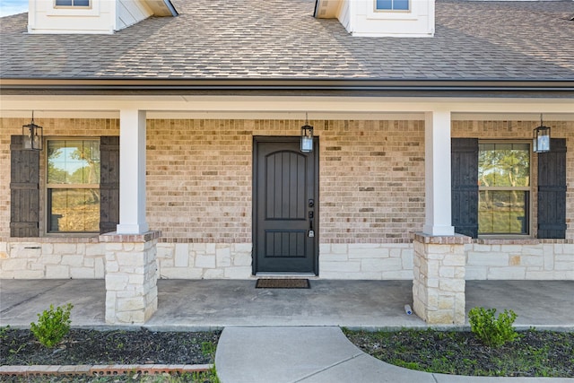 doorway to property with a porch