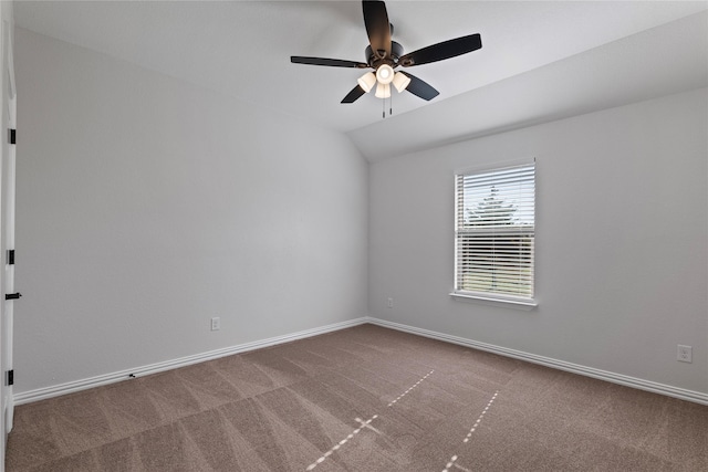 carpeted empty room featuring ceiling fan and lofted ceiling