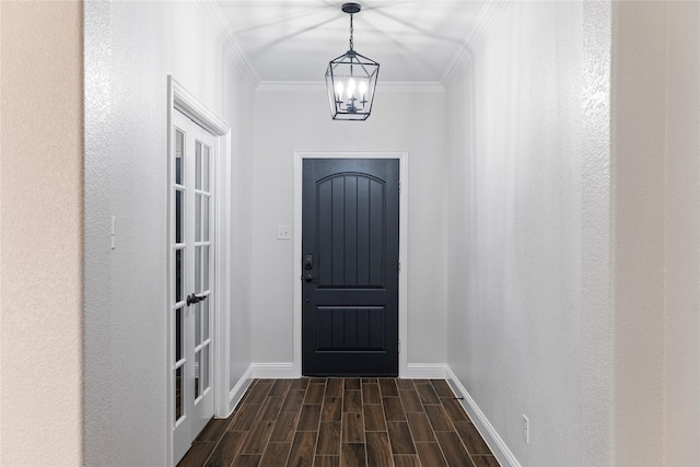 doorway to outside with ornamental molding and a notable chandelier