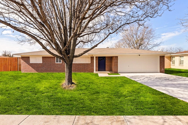 ranch-style house featuring a garage and a front yard