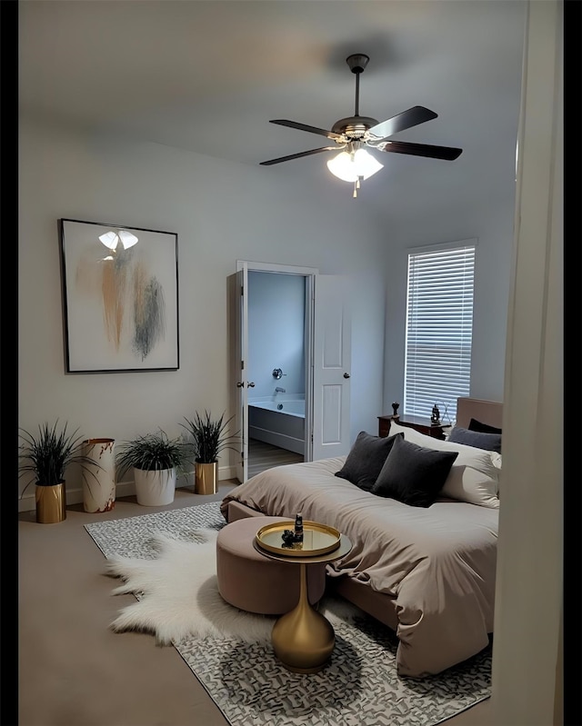 bedroom with ensuite bathroom and ceiling fan