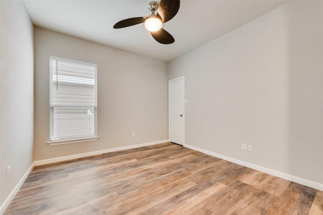 empty room featuring ceiling fan and light wood-type flooring