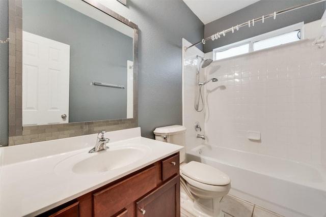 full bathroom featuring toilet, vanity, and bathtub / shower combination