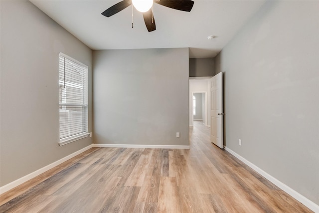 unfurnished room featuring ceiling fan and light wood-type flooring