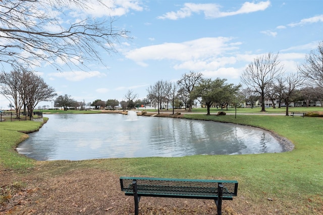 view of property's community featuring a water view and a lawn