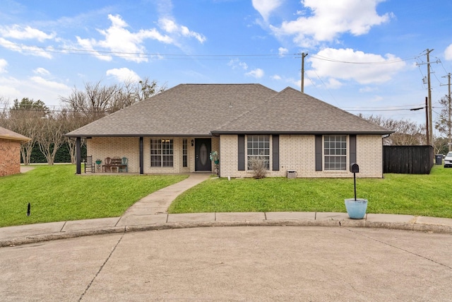 ranch-style house featuring a front lawn