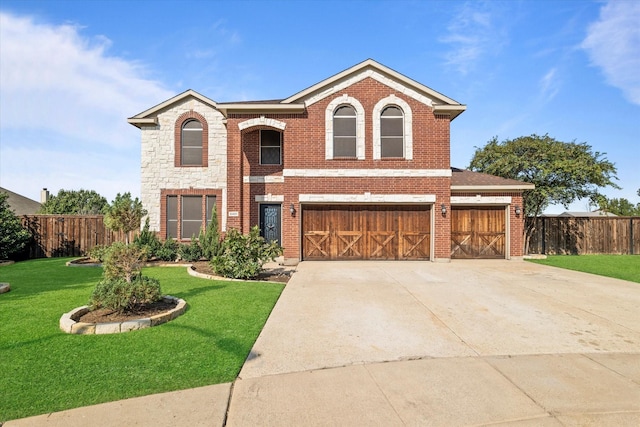 front of property featuring a garage and a front yard