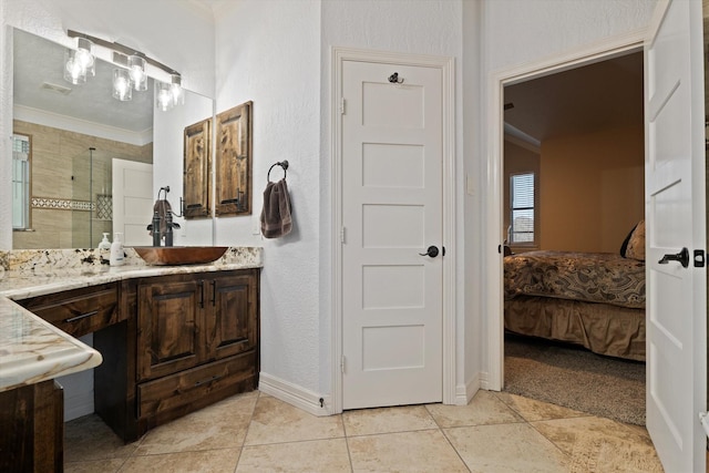 5401 Loftsmoor Ct, Fort Worth, TX 76244 - bathroom featuring crown molding, vanity, connected bathroom, a shower stall, and baseboards