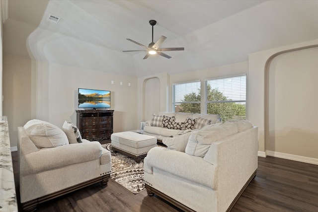 living room featuring vaulted ceiling, dark hardwood / wood-style floors, and ceiling fan