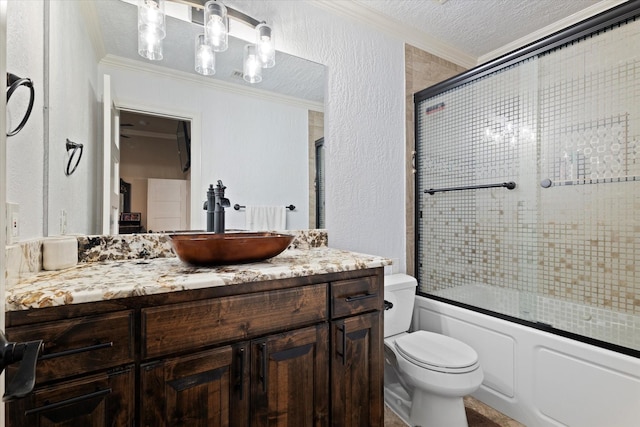 full bathroom featuring crown molding, combined bath / shower with glass door, a textured ceiling, and toilet