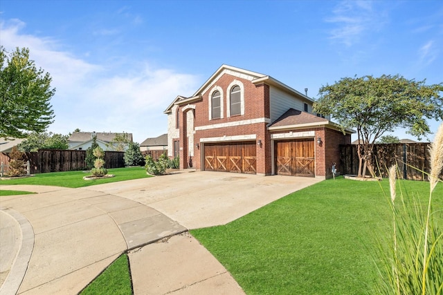 front of property featuring a garage and a front lawn