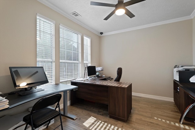 office space with hardwood / wood-style flooring, ornamental molding, a textured ceiling, and ceiling fan