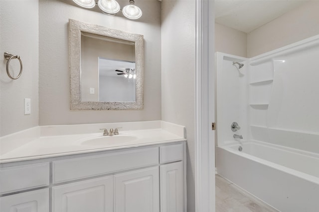 bathroom with vanity and  shower combination