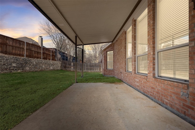 patio terrace at dusk with a yard