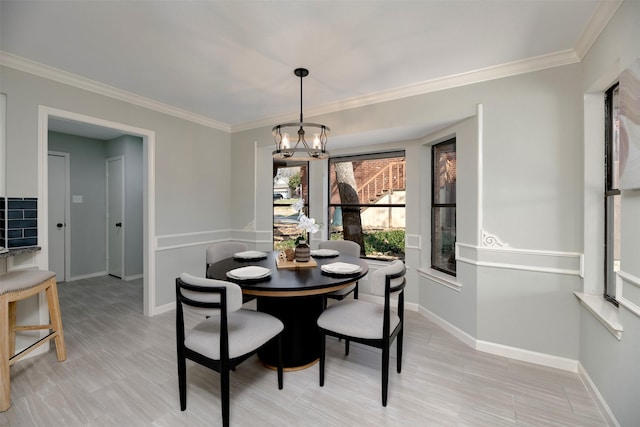 dining room featuring ornamental molding and a chandelier