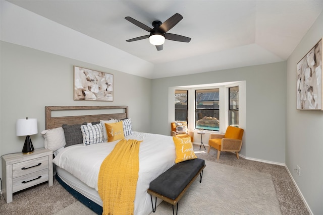 bedroom featuring light carpet, vaulted ceiling, and ceiling fan