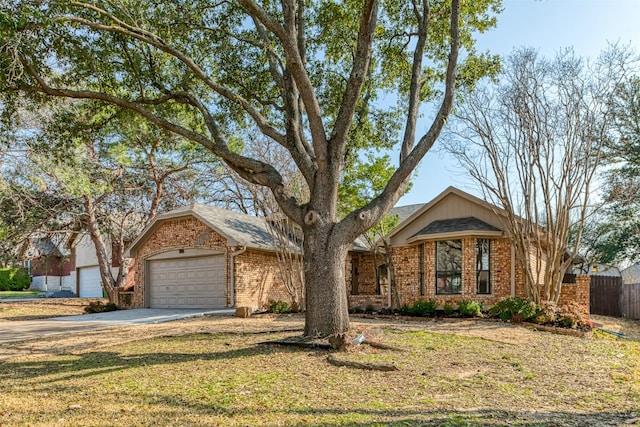 single story home with a garage and a front lawn