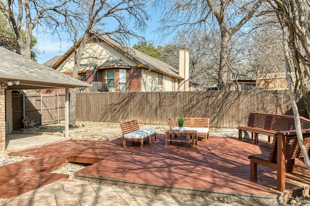 wooden terrace featuring a gazebo and outdoor lounge area