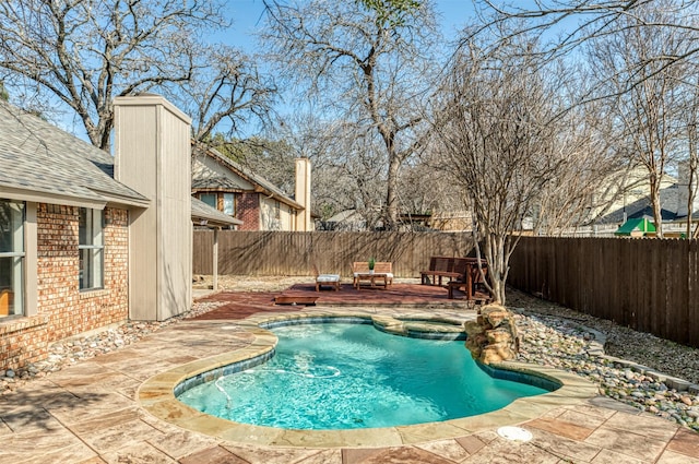 view of swimming pool featuring a patio area and a deck