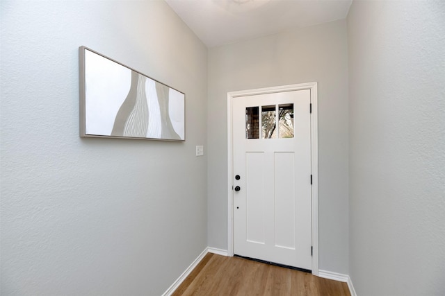 doorway to outside featuring light wood-type flooring