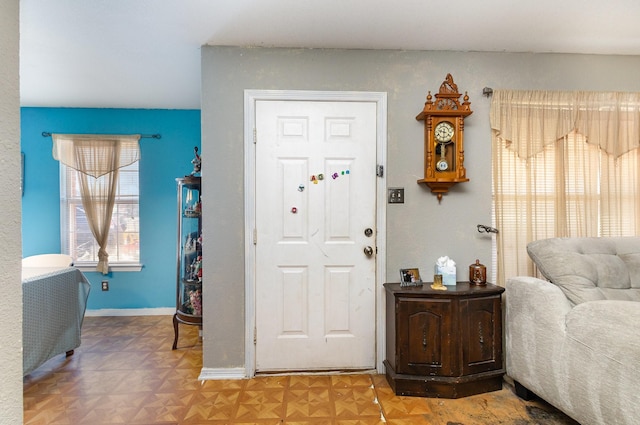 foyer entrance with baseboards