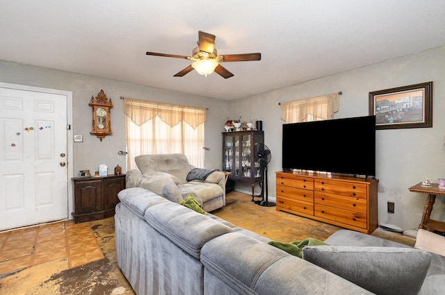 living area with ceiling fan