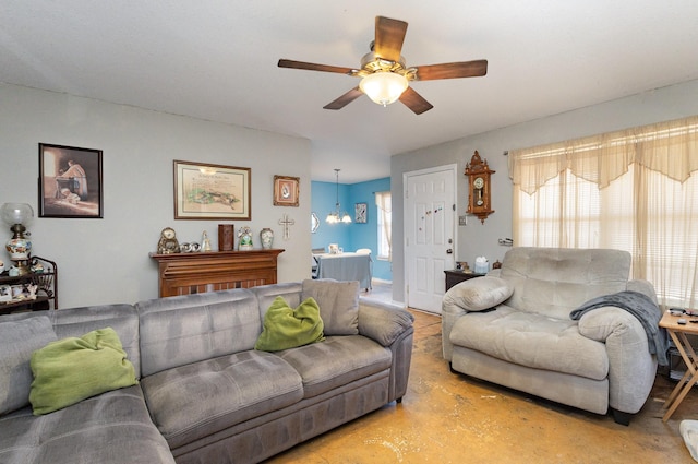 living room with concrete flooring and a ceiling fan