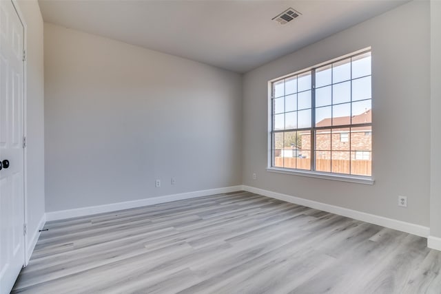 unfurnished room featuring light wood-type flooring