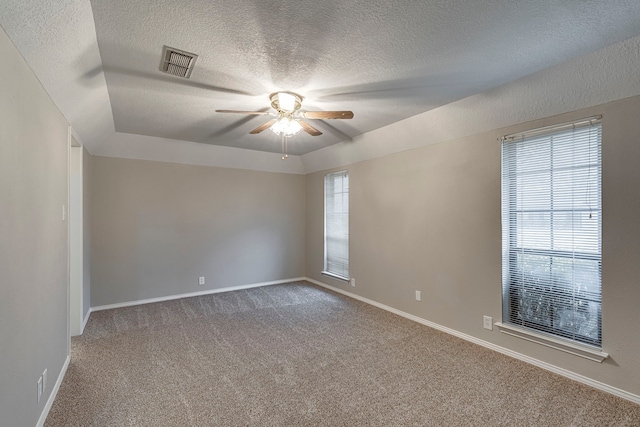 unfurnished room with carpet flooring, a textured ceiling, and ceiling fan