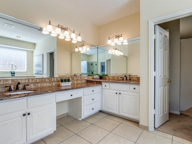 full bathroom featuring tile patterned flooring, visible vents, a sink, and double vanity