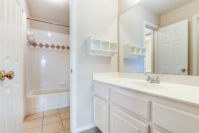 bathroom with tile patterned flooring, washtub / shower combination, and vanity