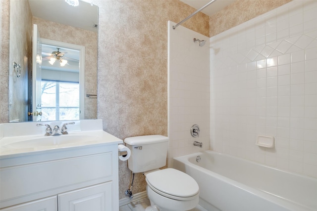 full bath featuring  shower combination, vanity, toilet, and wallpapered walls