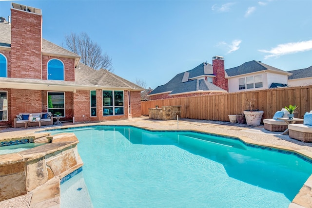 view of swimming pool with a fenced backyard, an in ground hot tub, an outdoor living space, a fenced in pool, and a patio area