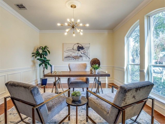 office area featuring a chandelier, light wood finished floors, and visible vents