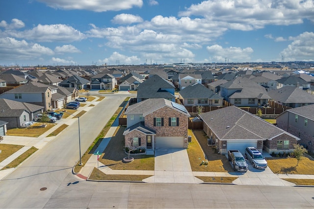 birds eye view of property with a residential view