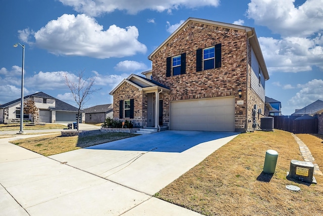 traditional-style home with brick siding, fence, central air condition unit, a garage, and driveway