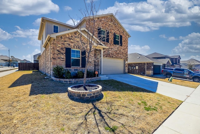 view of front of property with brick siding, fence, concrete driveway, a front yard, and an attached garage