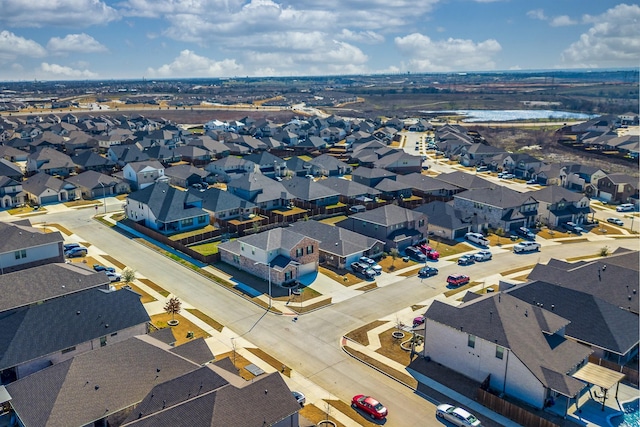 bird's eye view featuring a residential view and a water view