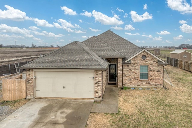 view of front facade with a garage and a front yard