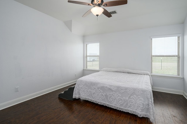 bedroom with dark wood-type flooring and ceiling fan