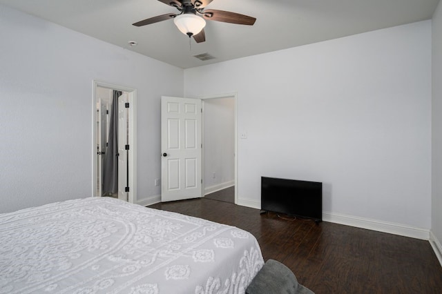 bedroom with dark wood-type flooring and ceiling fan