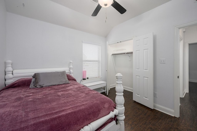 bedroom with lofted ceiling, dark hardwood / wood-style floors, ceiling fan, and a closet